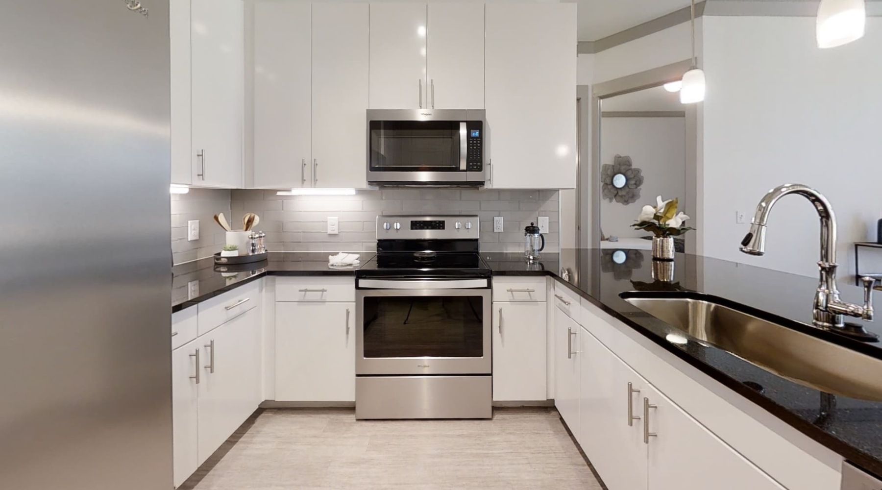 kitchen showing an island, bright lighting and modern appliances