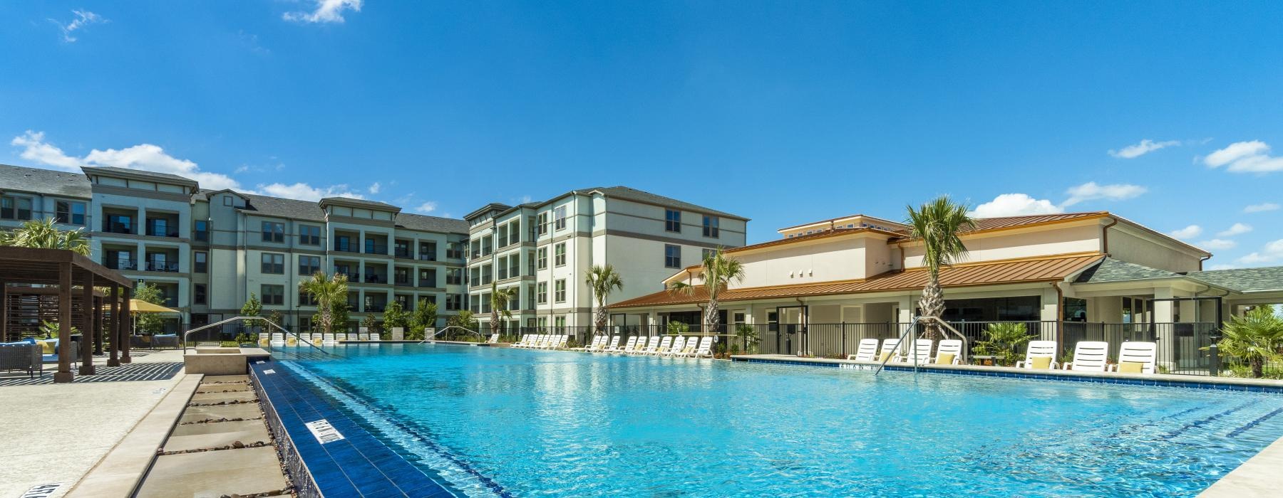 a swimming pool in front of a building
