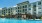a large building with a pool in front of it
