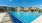 a swimming pool in front of a building