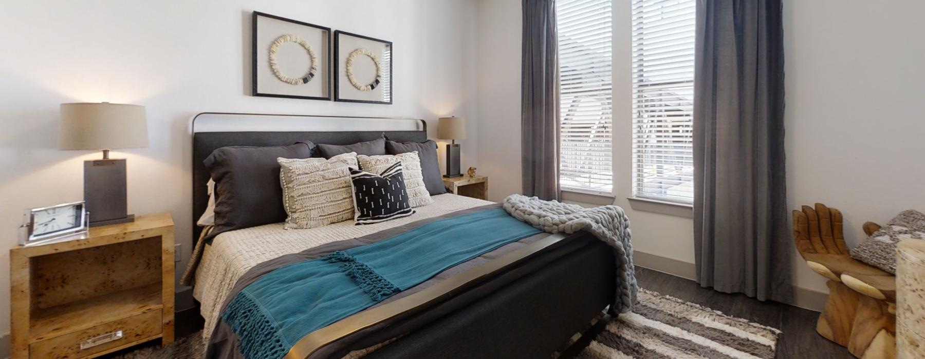 a bedroom with a bed and a chair