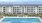 a large building with a pool in front of it